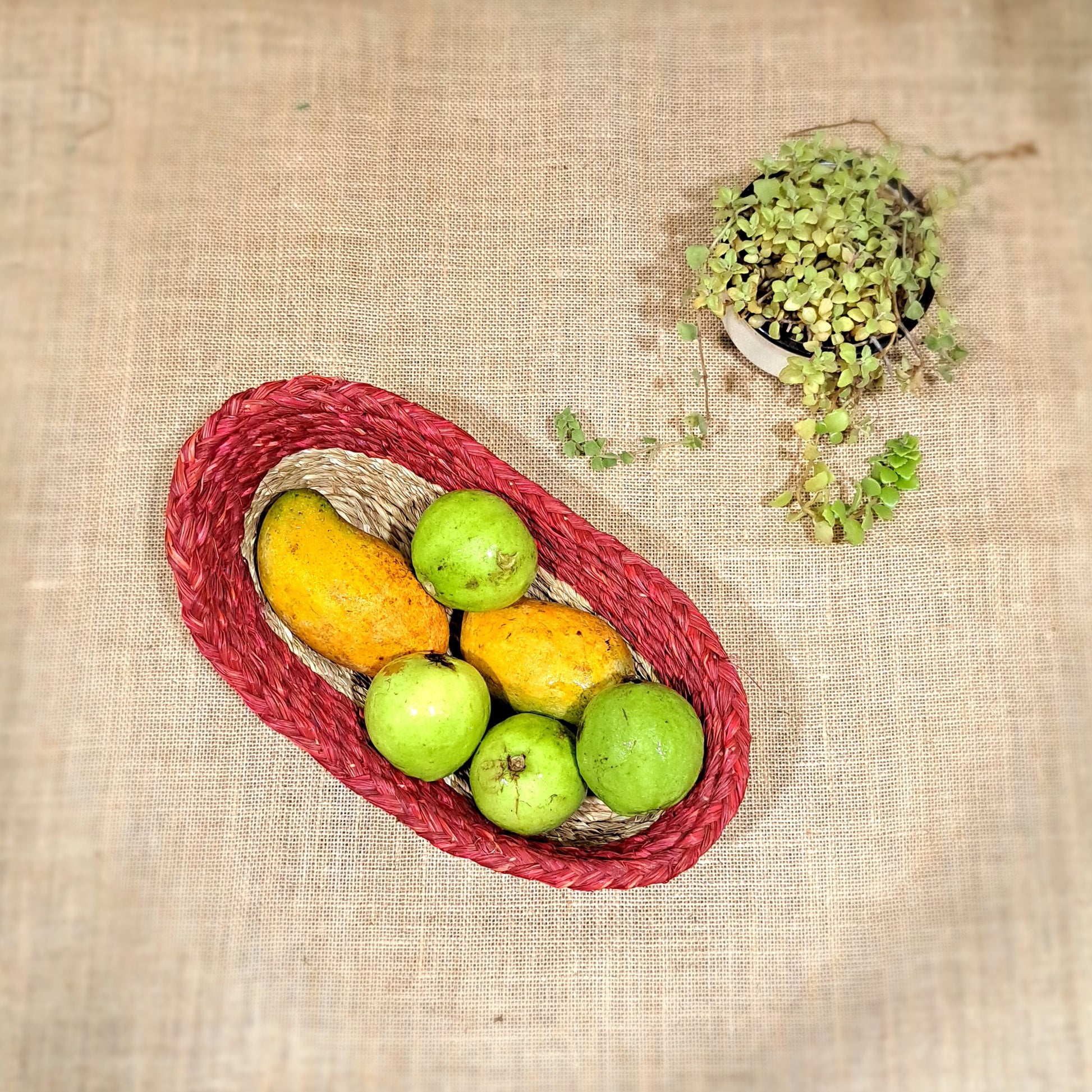 Top view of Boat shaped sabai grass tray/basket with fruits